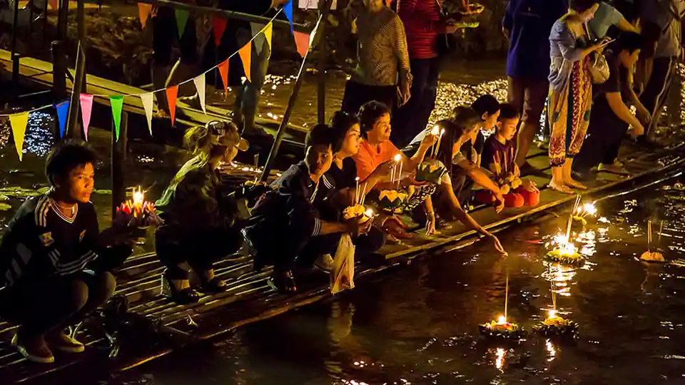 Floating decorated baskets on rivers and canals at night