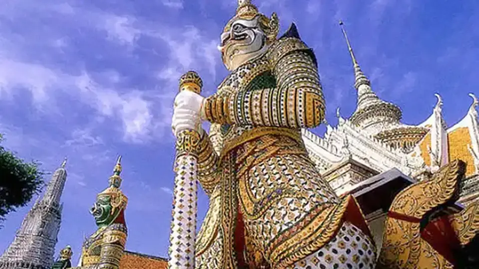 Wat Pho in Bangkok Colorful giant Yaksha guardian statue standing at the entrance of Wat Phra Kaew in Bangko