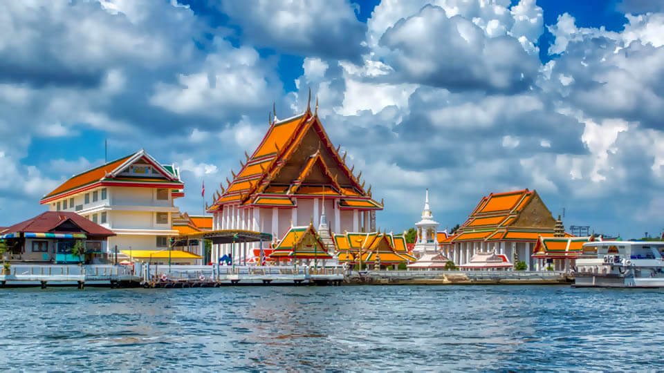 This temple is located on the western bank of the Chao Phraya River. It's an often-overlooked but impressive site with a giant Buddha statue and beautiful murals.
